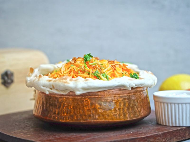 Biryani served in a copper handi