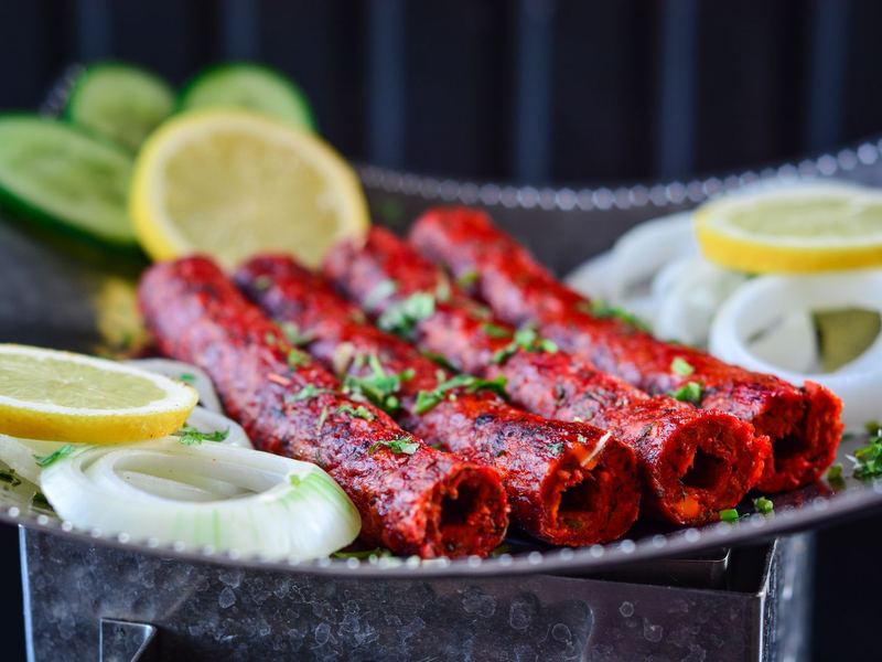 Kebabs served with onion and lemon